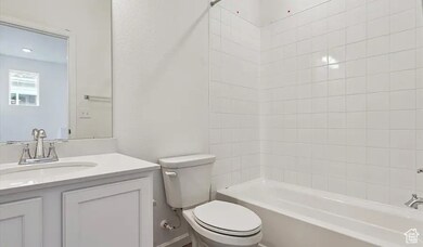 Bathroom featuring vanity and shower / washtub combination