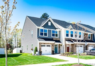 View of front of property with a garage, a front y