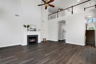 living room with a fireplace, dark hardwood / wood
