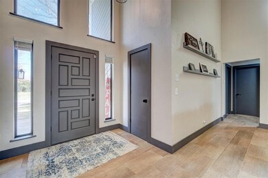 Entrance foyer featuring a high ceiling