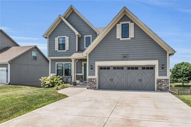 Craftsman-style home featuring a front lawn