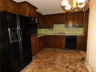 Kitchen with many cabinets.