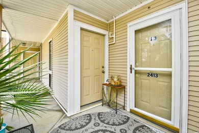 Entrance to property featuring a porch