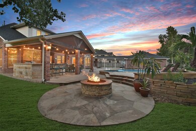Outdoor custom fire pit area situated on the large side yard of the home.