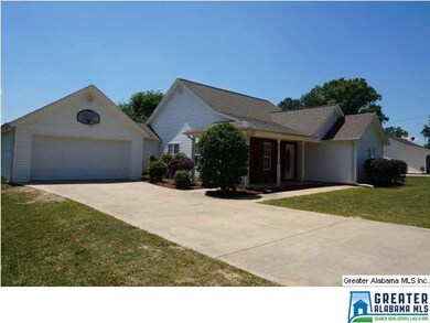 More front view showing garage