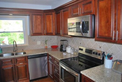 Beautiful Maple Cabinets with SS appliances and gr