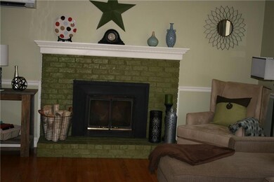 Brick fireplace in Living Room.