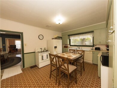 Kitchen looking out into dining room and living ro