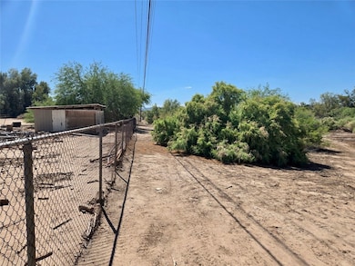 View of property featuring fence and a view of cou