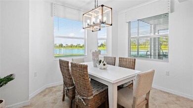 Dining space with crown molding, a chandelier, and