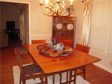 Formal dining room has new pewter chandelier.