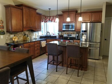 updated kitchen with quartz countertops, granite s