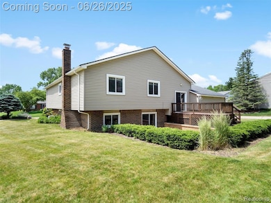 View of back of home and large corner lot