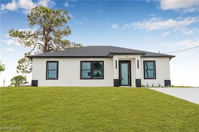 Prairie-style home featuring stucco siding, a shin