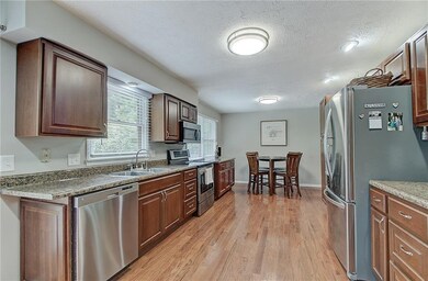More hardwood floors flow throughout the kitchen and breakfast room.