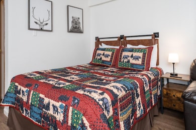 Queen-size bed completes sleeping for four.
