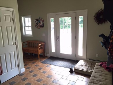 Entry/mudroom with closet and half...