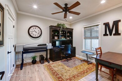 Home office featuring light hardwood / wood-style 