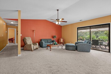 Vaulted Living Room with Patio Access
