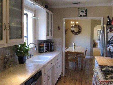 Comfortable kitchen with a garden window, and tile