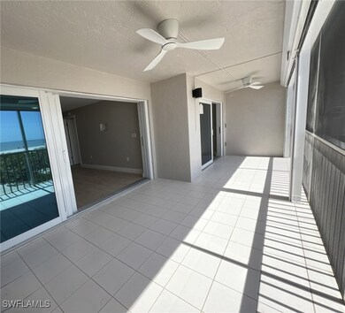 Unfurnished sunroom with a ceiling fan