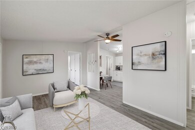 17x11 Living room -new plank laminate 
flooring , lighted ceiling fan
DIGITALLY STAGED