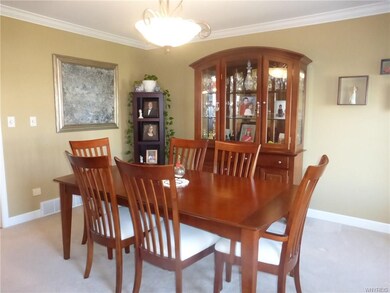 Formal dining room boasts crown molding