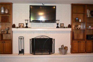 Close-up of fireplace and built-in bookshelves.