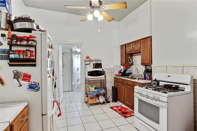718 Third St - Kitchen w/ gas range view 1