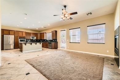 Kitchen featuring stainless steel appliances, a br