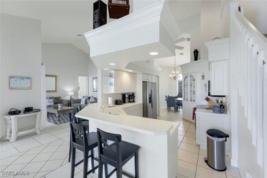 Kitchen featuring an inviting chandelier, light ti