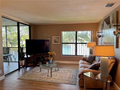 Living room area overlook lake with sliding glass