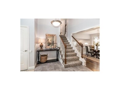 Welcoming vaulted entry with Niche