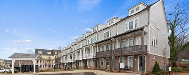 View of property with a residential view and uncovered parking
