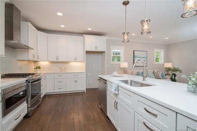 Spacious breakfast bar with unique pendant lightin