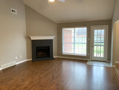 Family room with beautiful wood floors, fireplace 