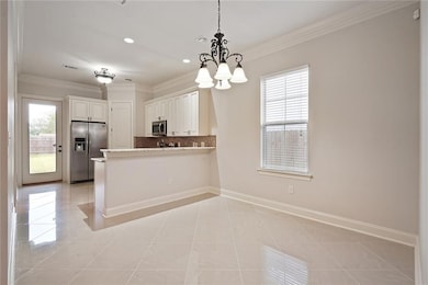 Dining room and kitchen with rear door to the back