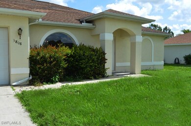 Doorway to property featuring a shingled roof, stu