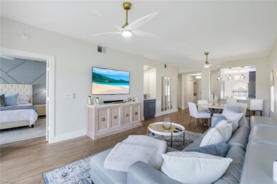 Living area featuring baseboards, visible vents, w
