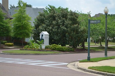 Looking out the front of the home, manicured divid