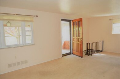 Spacious living room/dining space with original ha