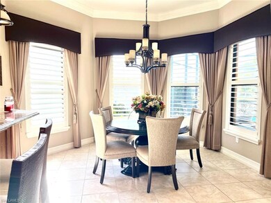 Tiled dining room with ornamental molding and a ch