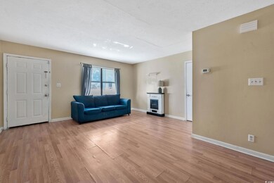 Unfurnished living room with a textured ceiling an