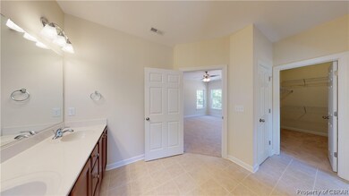 Master bath has double bowl vanity, shower and soa