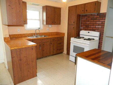 Spacious Kitchen with Refrigerator, Gas Stove, & P