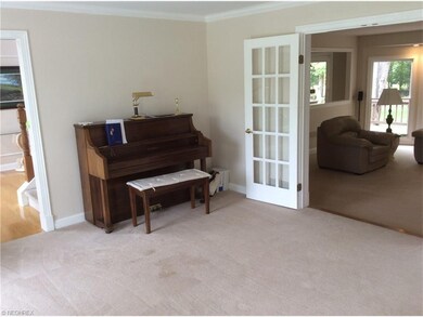 Living room with french doors leading to the famil