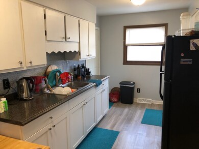 NEWER LAMINATE FLOORING - SOME CABINETS HAVE BEEN 