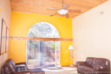 The Kitchen opens up to the spacious Family Room, with Wood Vaulted Ceilings. Family Room has carpet flooring.