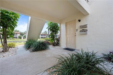 Property entrance featuring stucco siding