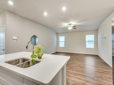Kitchen with sink, an island with sink, light hard